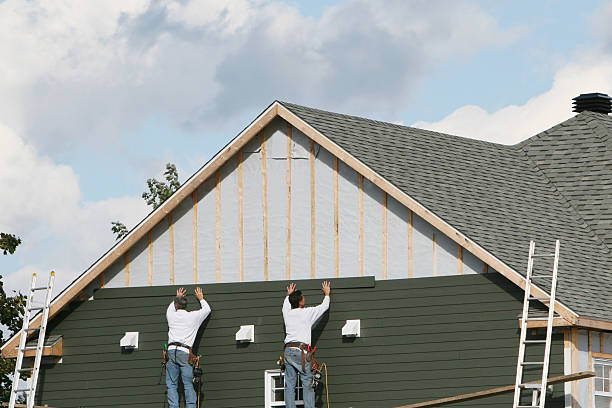 Professional Siding Installation technician working in Palm Bay, FL